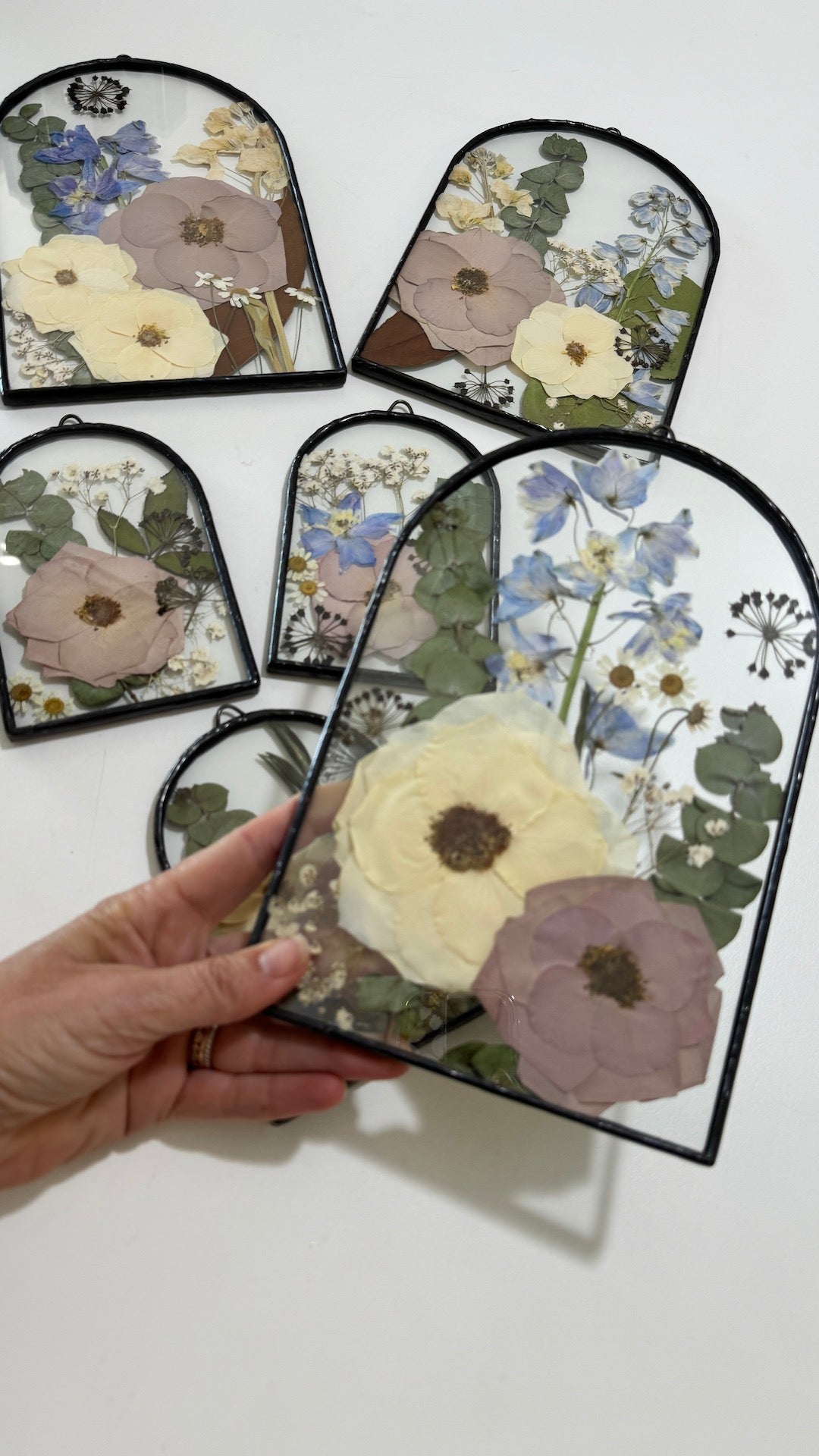 Arch shaped frame with pressed flowers