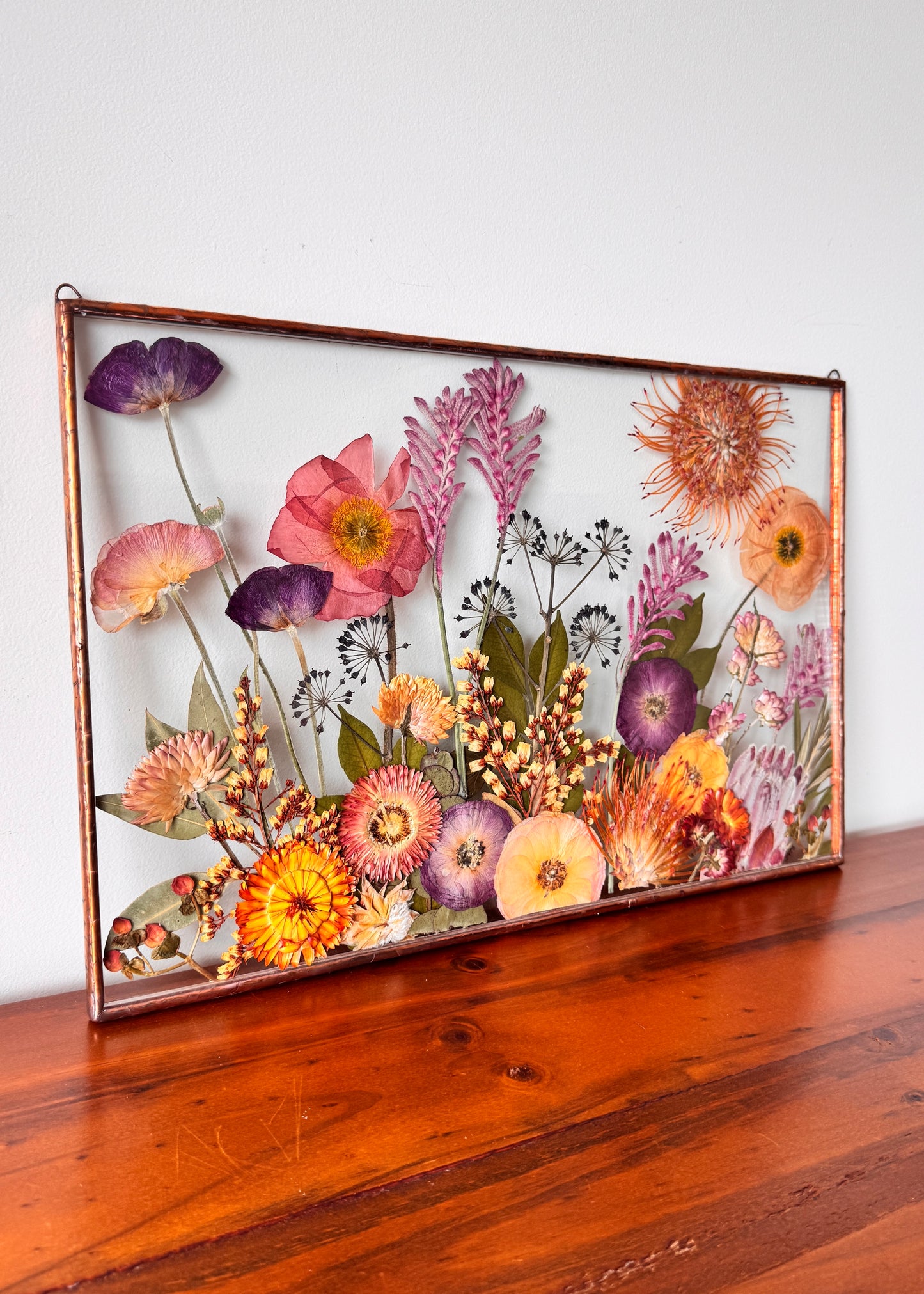 Pressed flower art in panorama frame