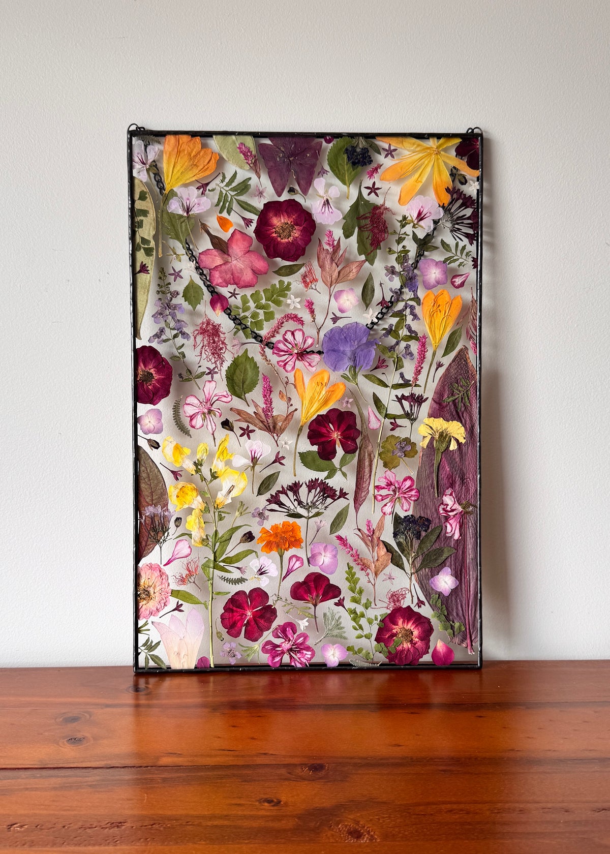 Pressed flowers from grandmas garden turned into art