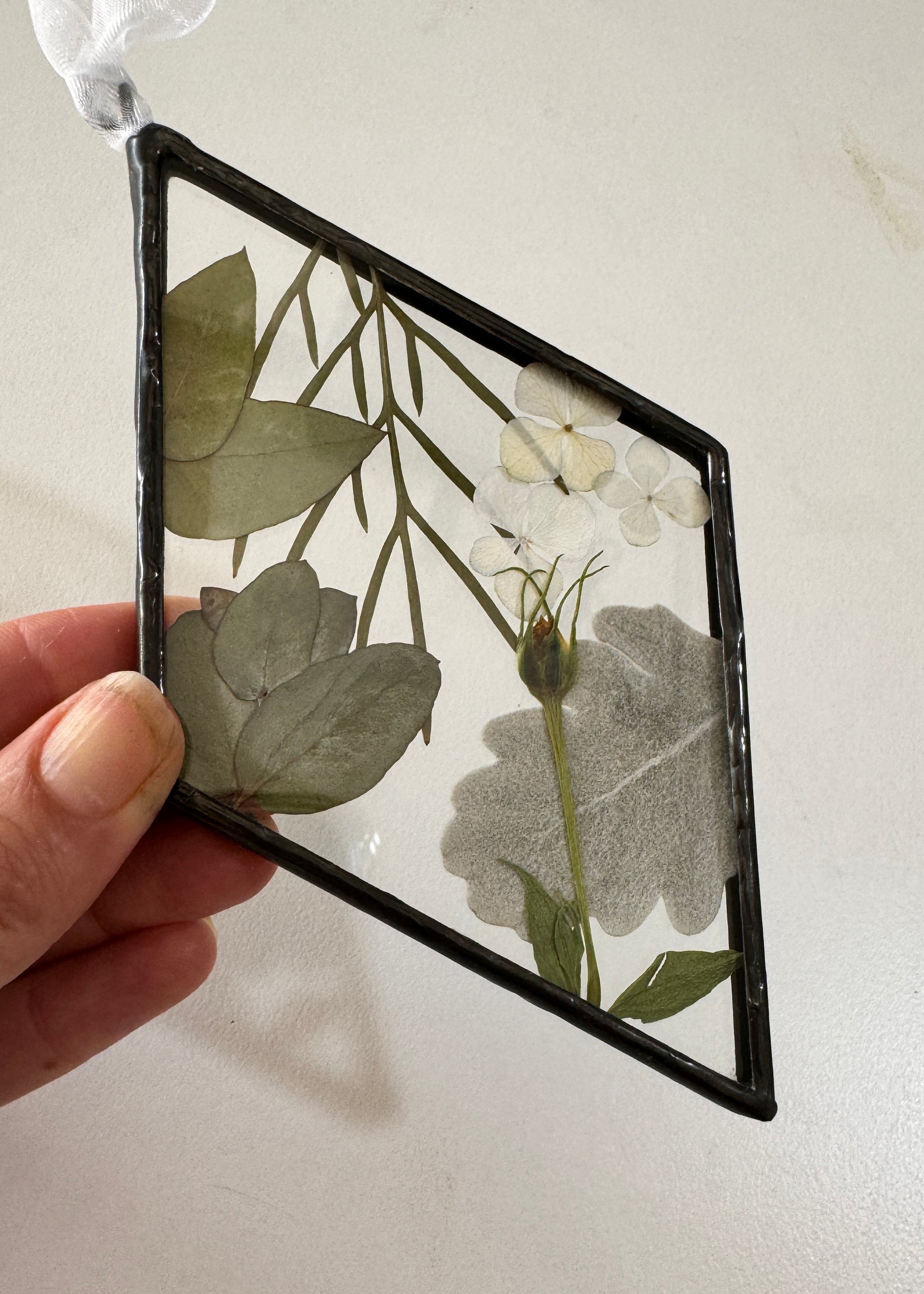 Soldered pressed flower ornament