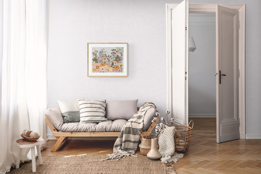 Living room with a wooden sofa, cushions, and a bright coloured pressed flower art  on the wall.