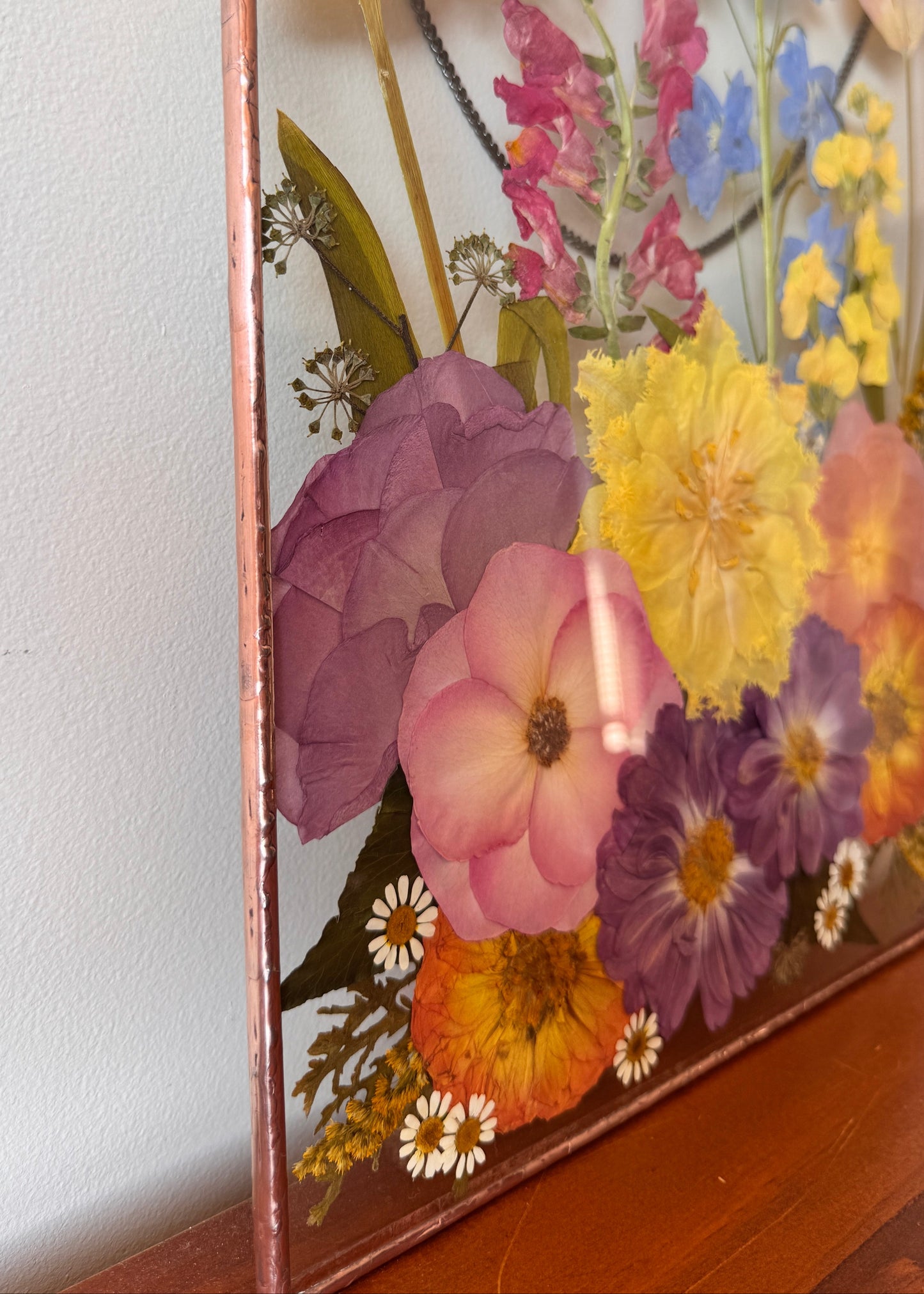 Stained glass flower art with copper patina frame