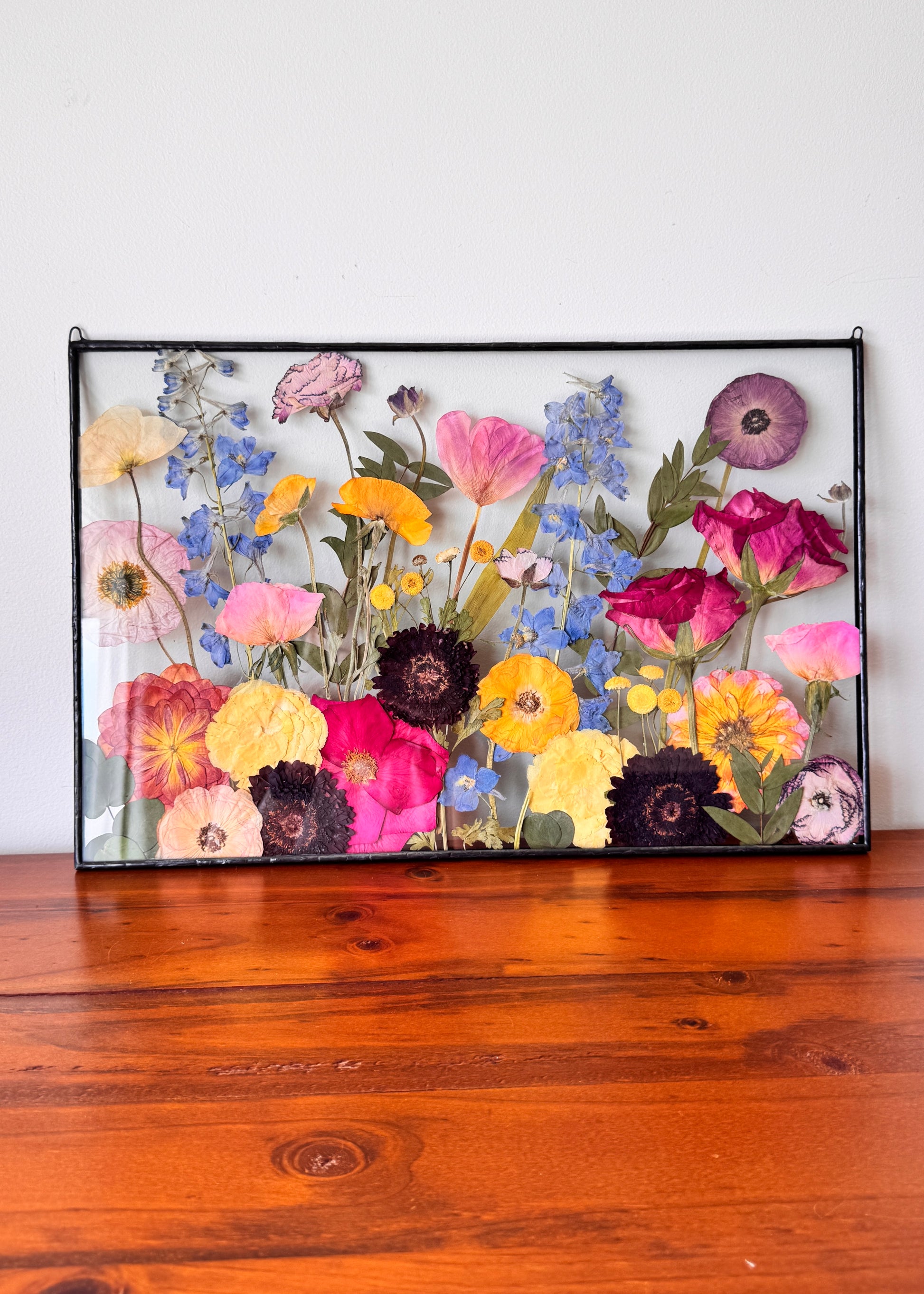 colourful bouquet preserved in metal frame