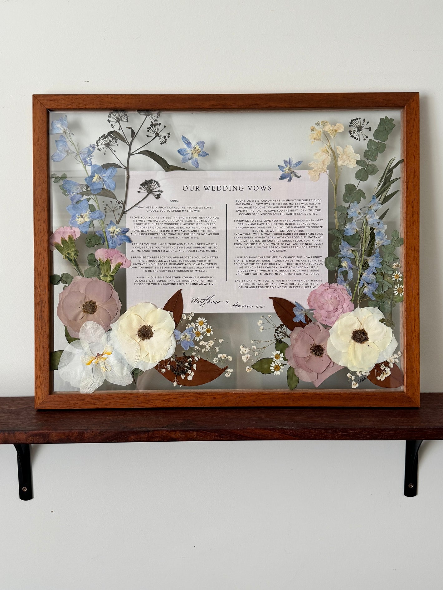 Framed pressed wedding bouquet with wedding vows