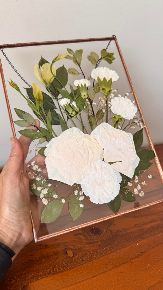 White and green pressed flowers in copper soldered frame
